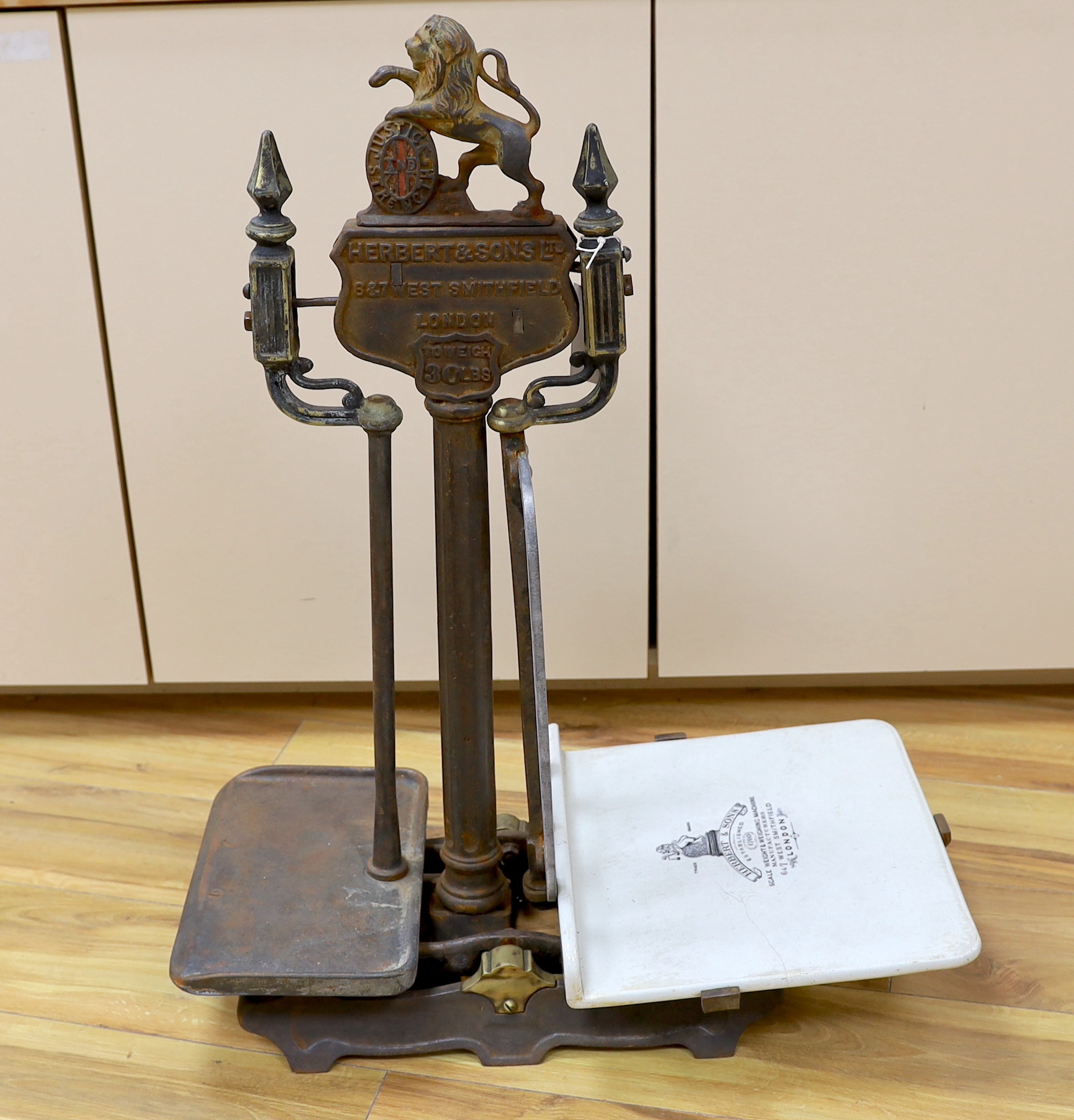 A 19th century Herbert & Sons Ltd. cast iron and porcelain scale set, height 76cm